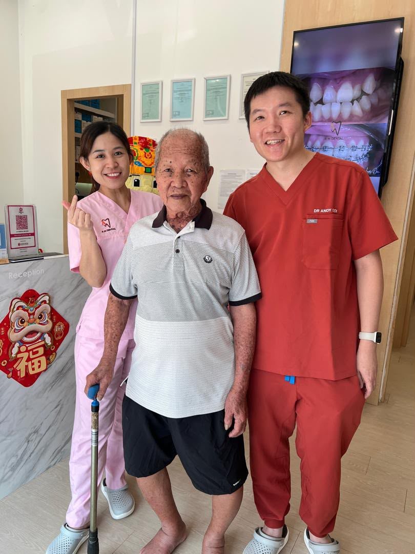 An elderly patient with the A M Dental team