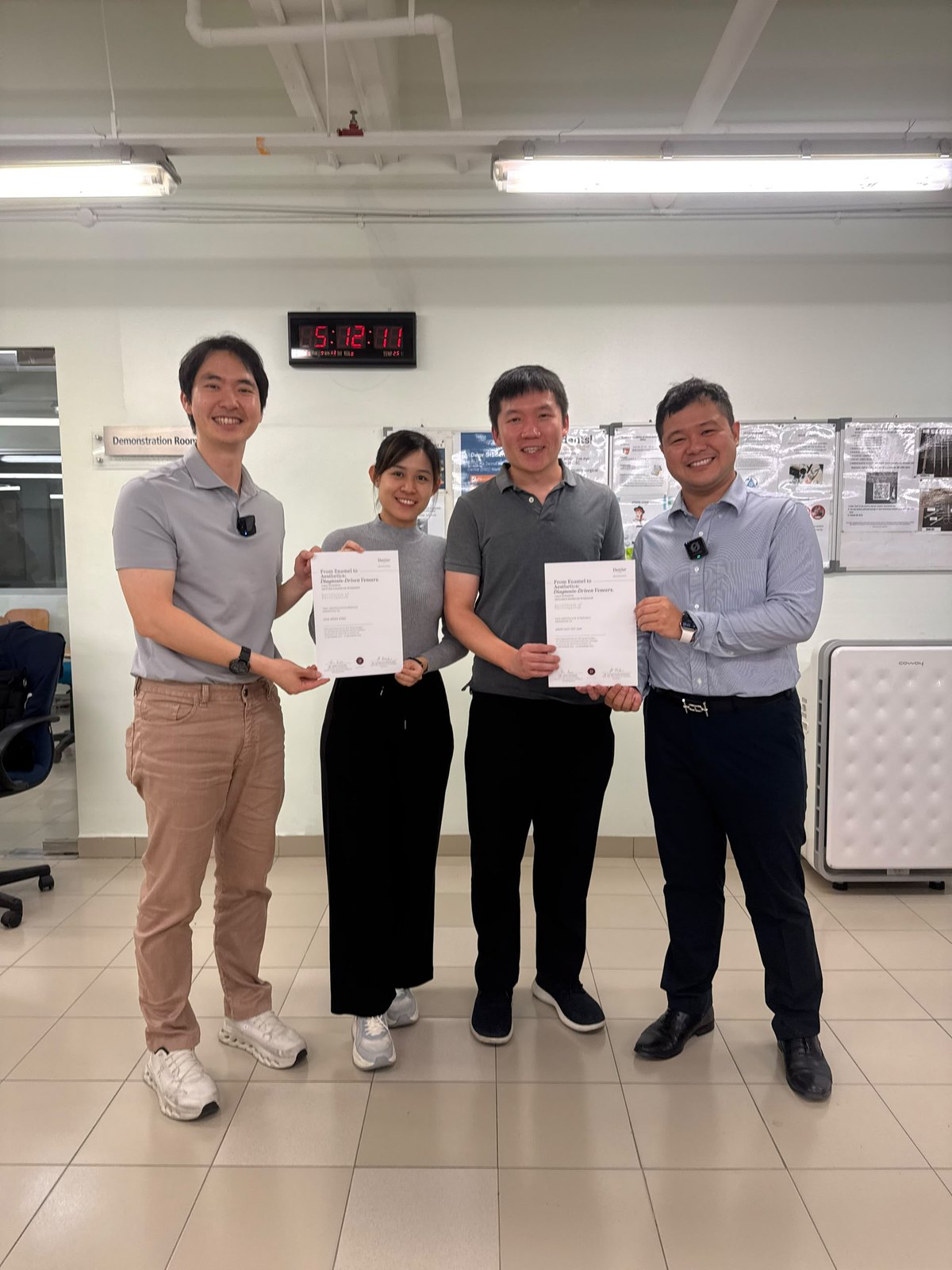 The A M Dental team receiving their course certificates