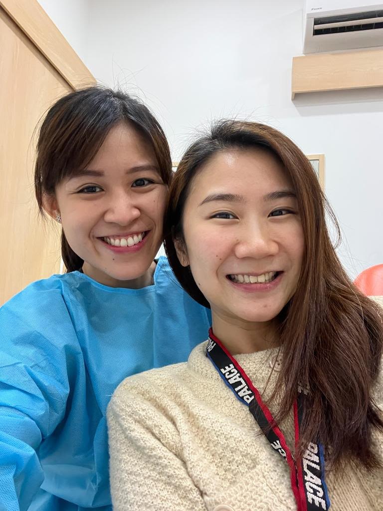 A patient with Dr. Mandy after her visit to A M Dental