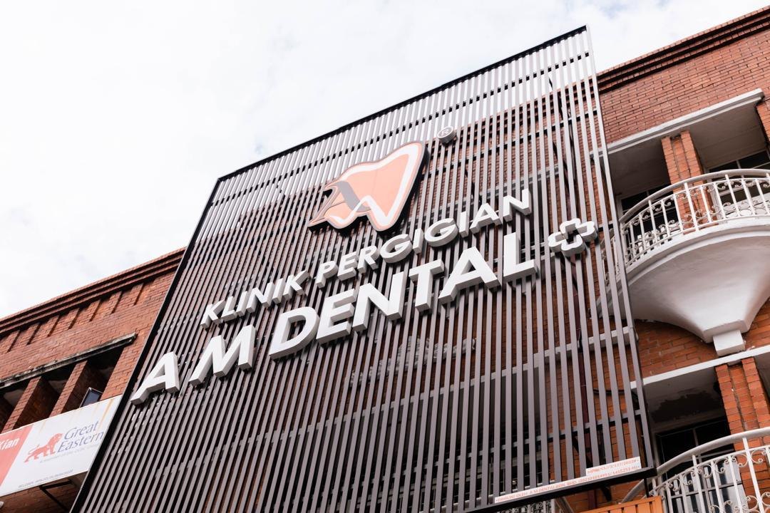 The A M Dental signage on the building facade